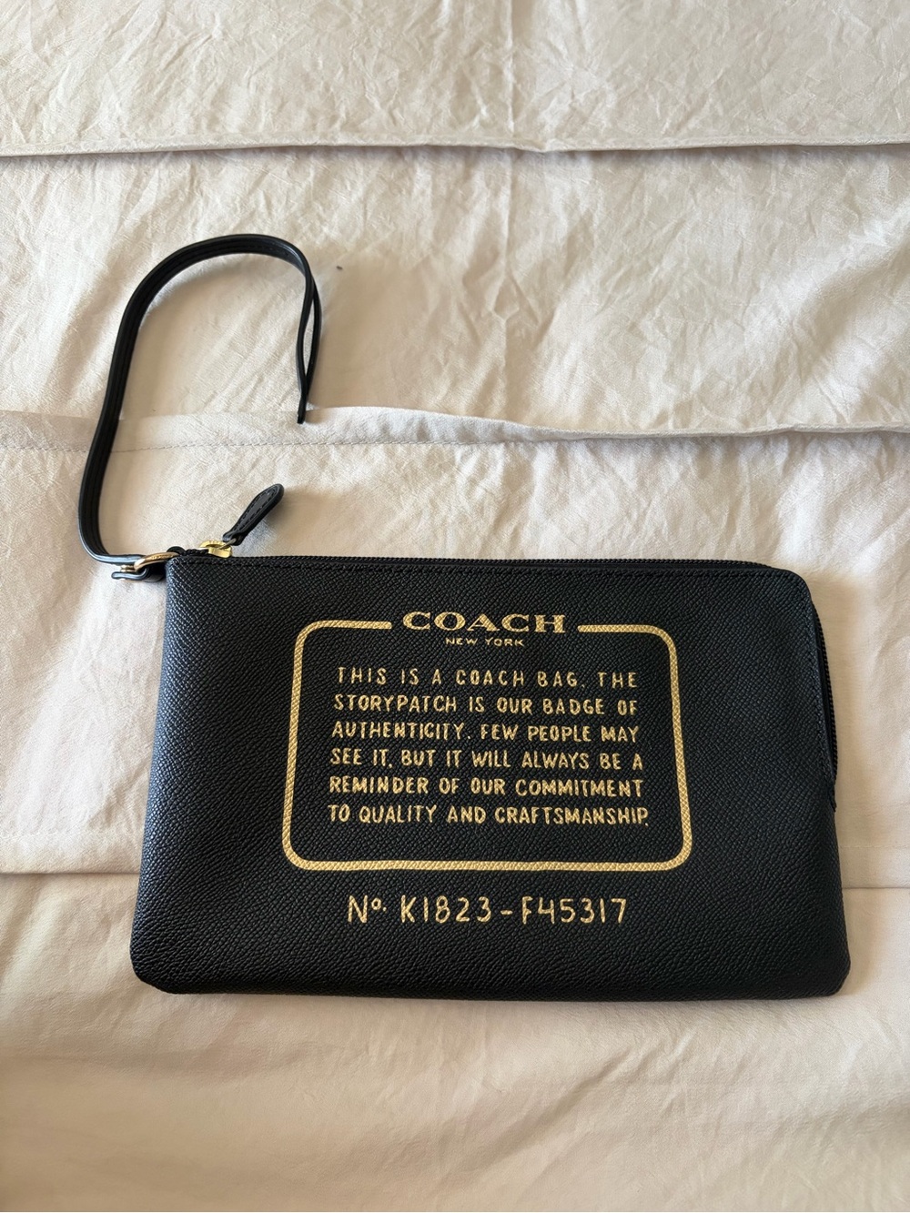 Coach Black Leather Wristlet with Gold Logo Print